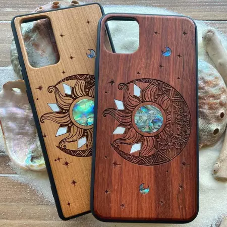 Engraved wood cases with Abalone shell inlay.
iphone case, sun and moon design 